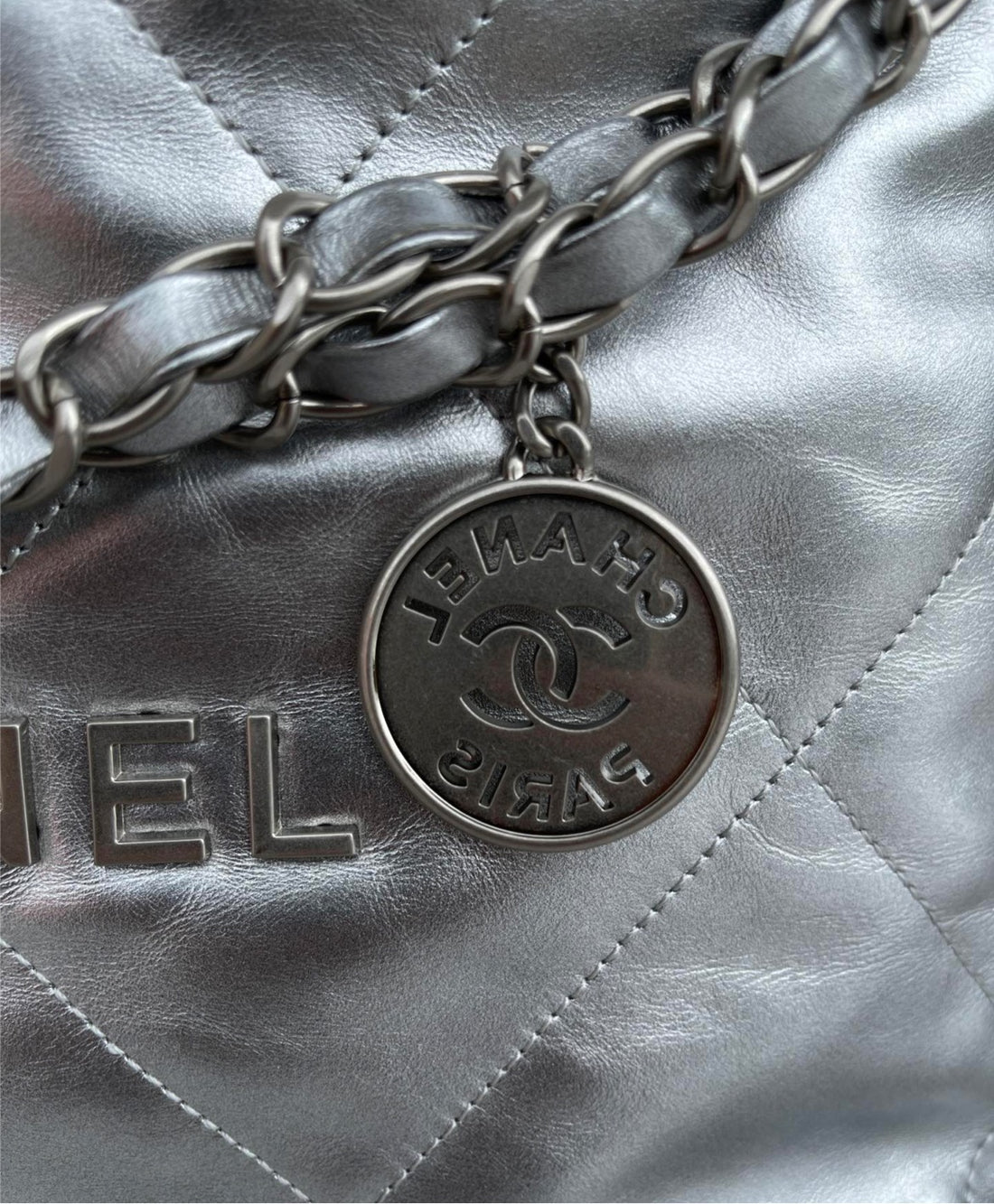 Silver Chanel woman shoulder handbag
