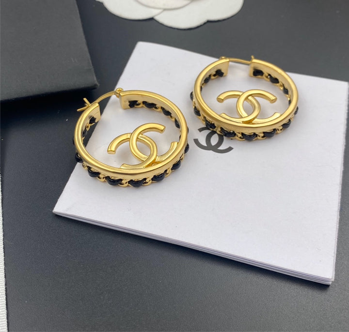 Woman Chanel hoop earrings