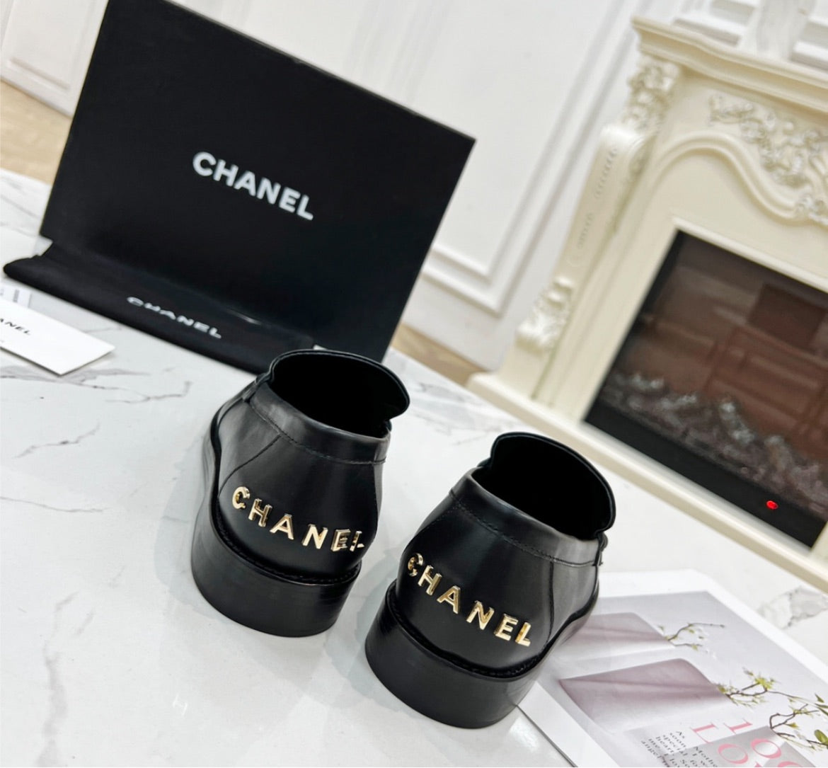 Black Chanel flat shoes