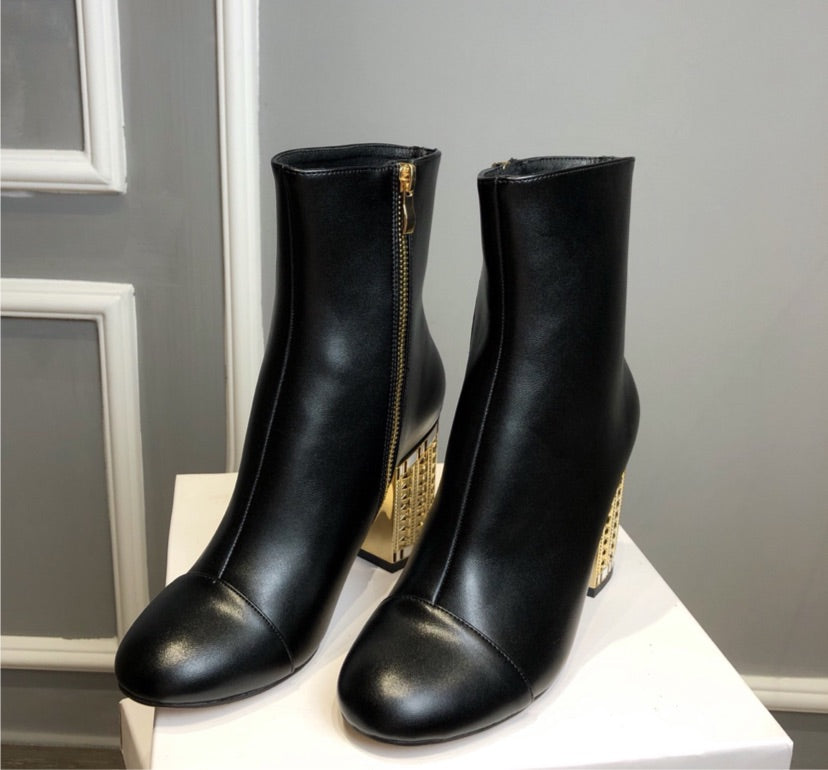 Black woman Chanel Boots