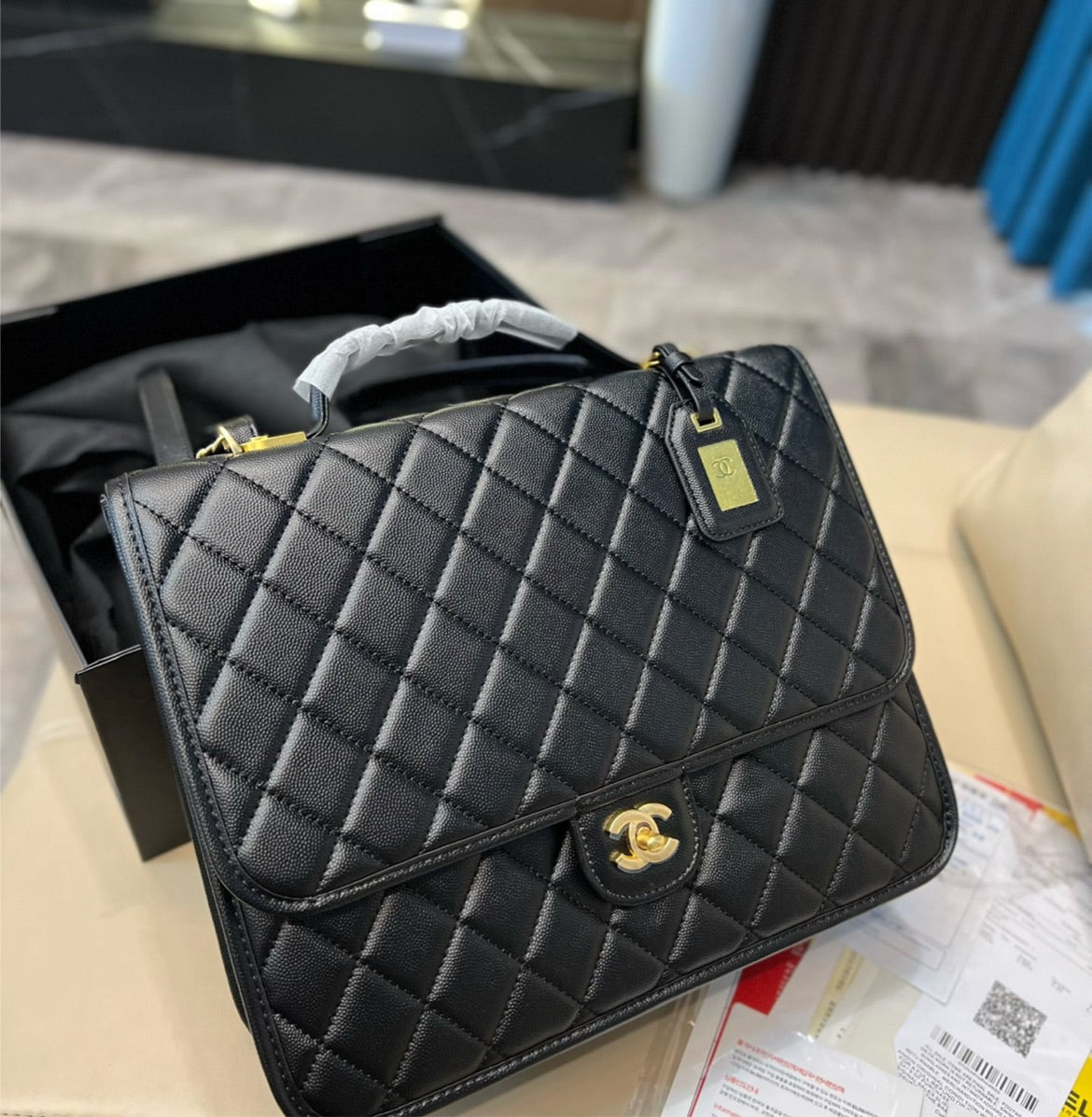 Woman Chanel black handbag