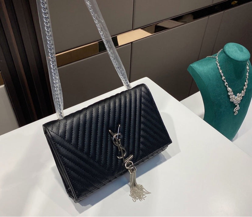 Black woman YSL shoulder handbag