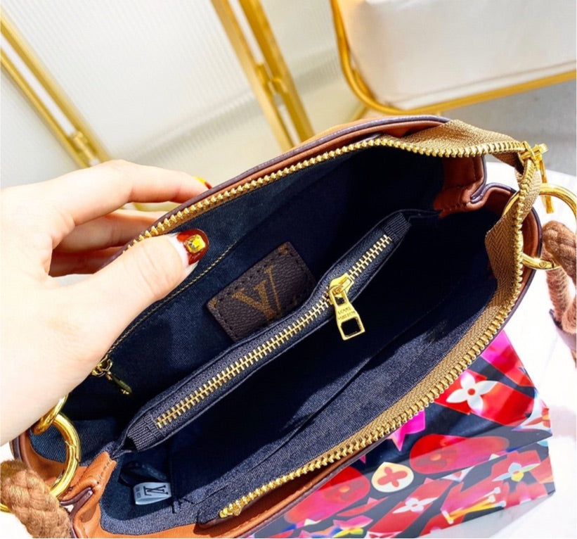 LV woman brown shoulder handbag