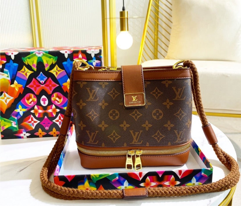 LV woman brown shoulder handbag