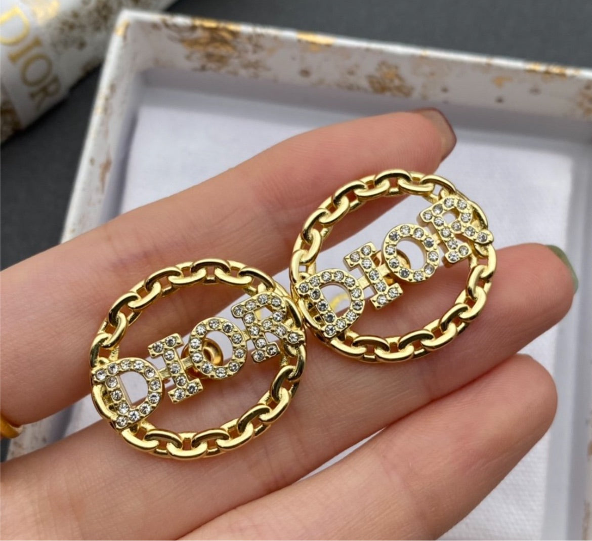 Dior woman hoop earring