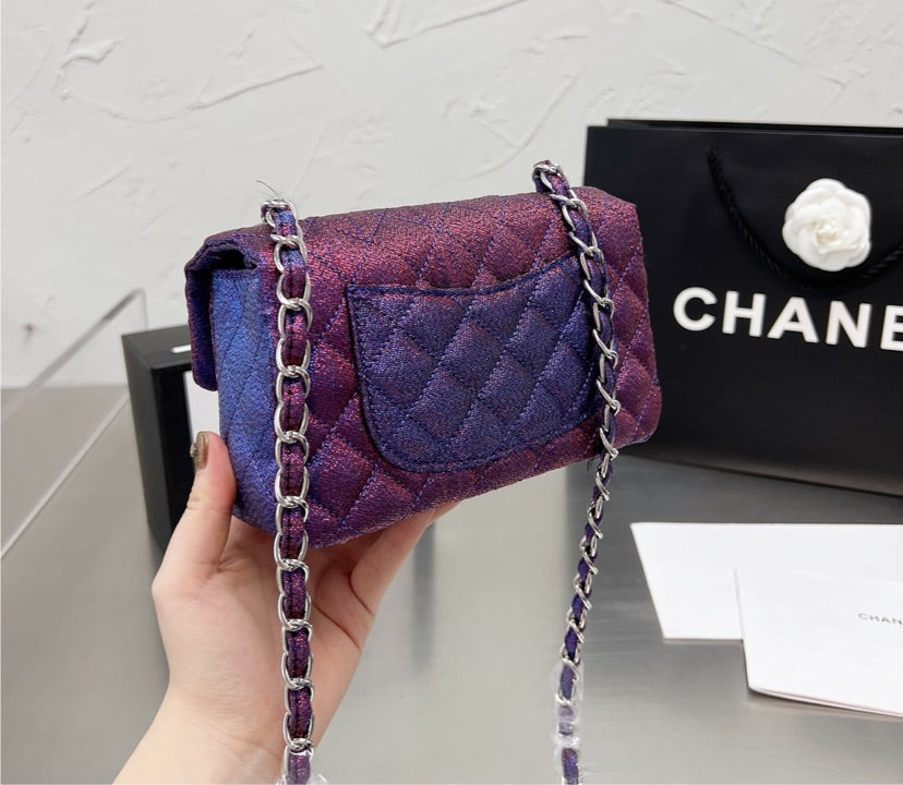 New woman Chanel purple handbag