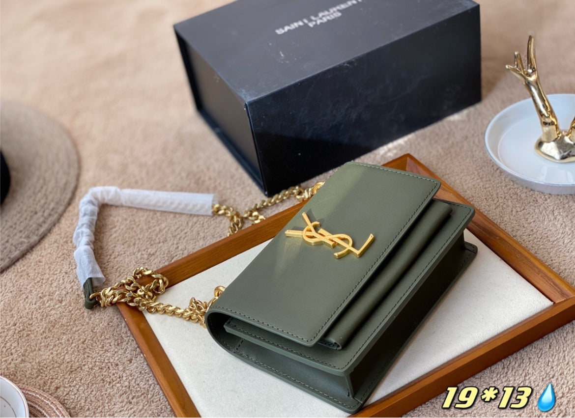 Green YSL woman shoulder handbag