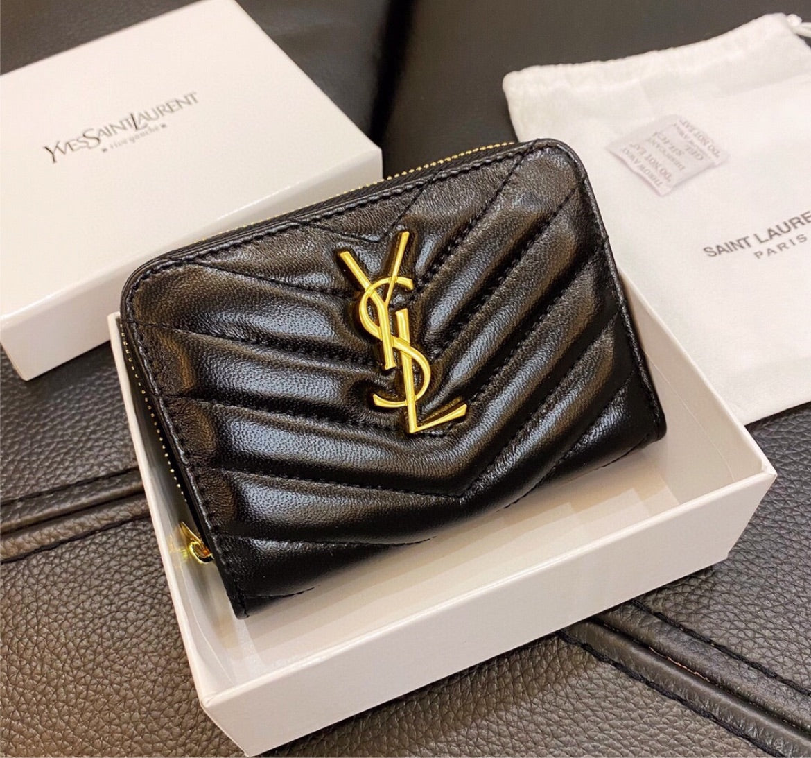 Woman YSL black wallet