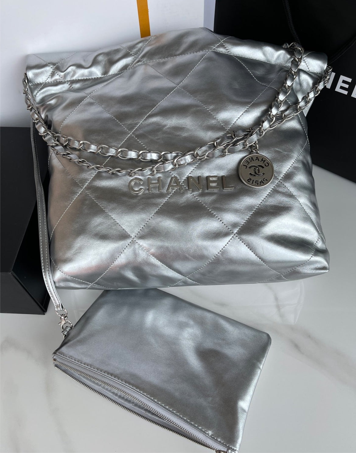Silver Chanel woman shoulder handbag