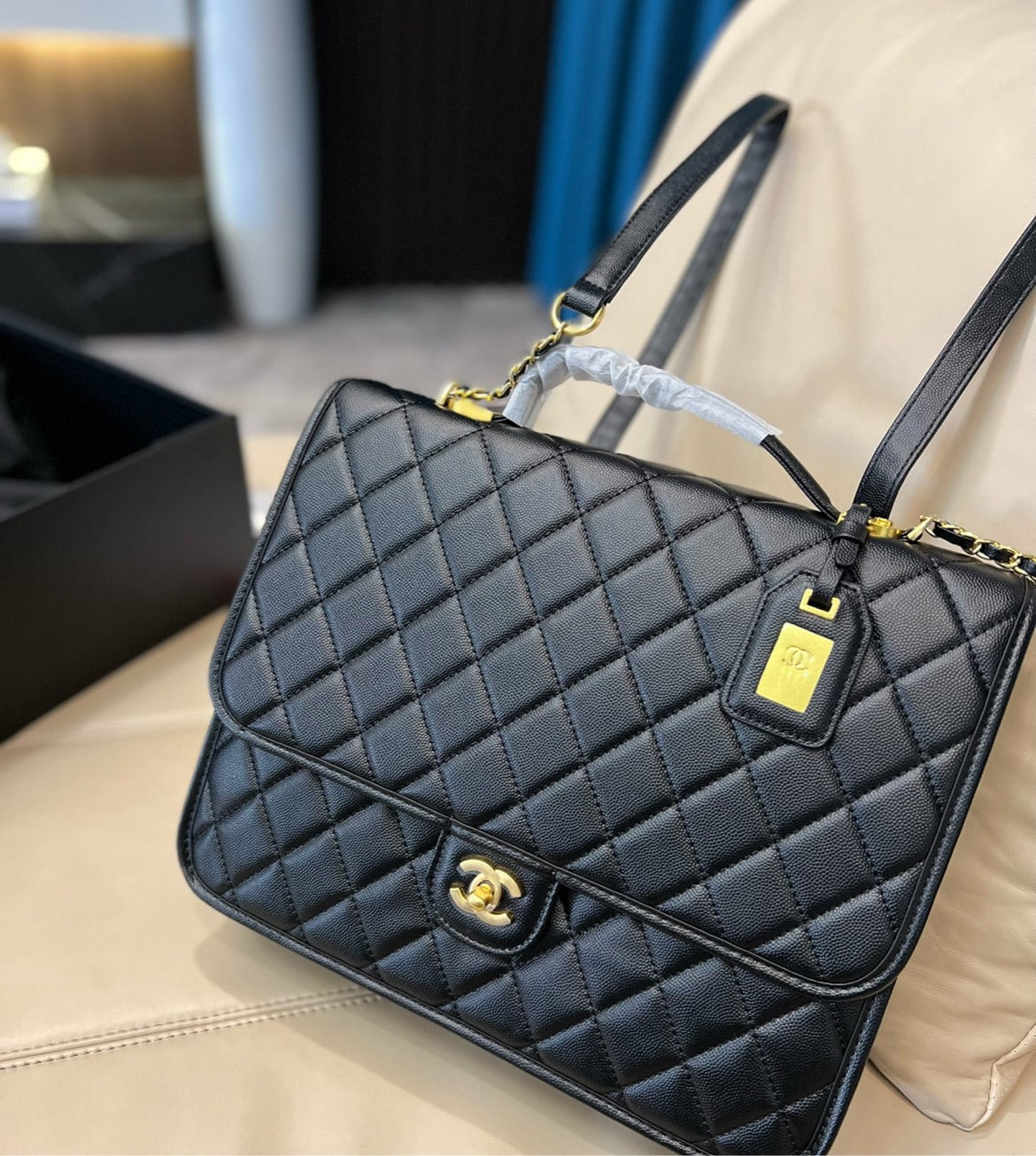 Woman Chanel black handbag