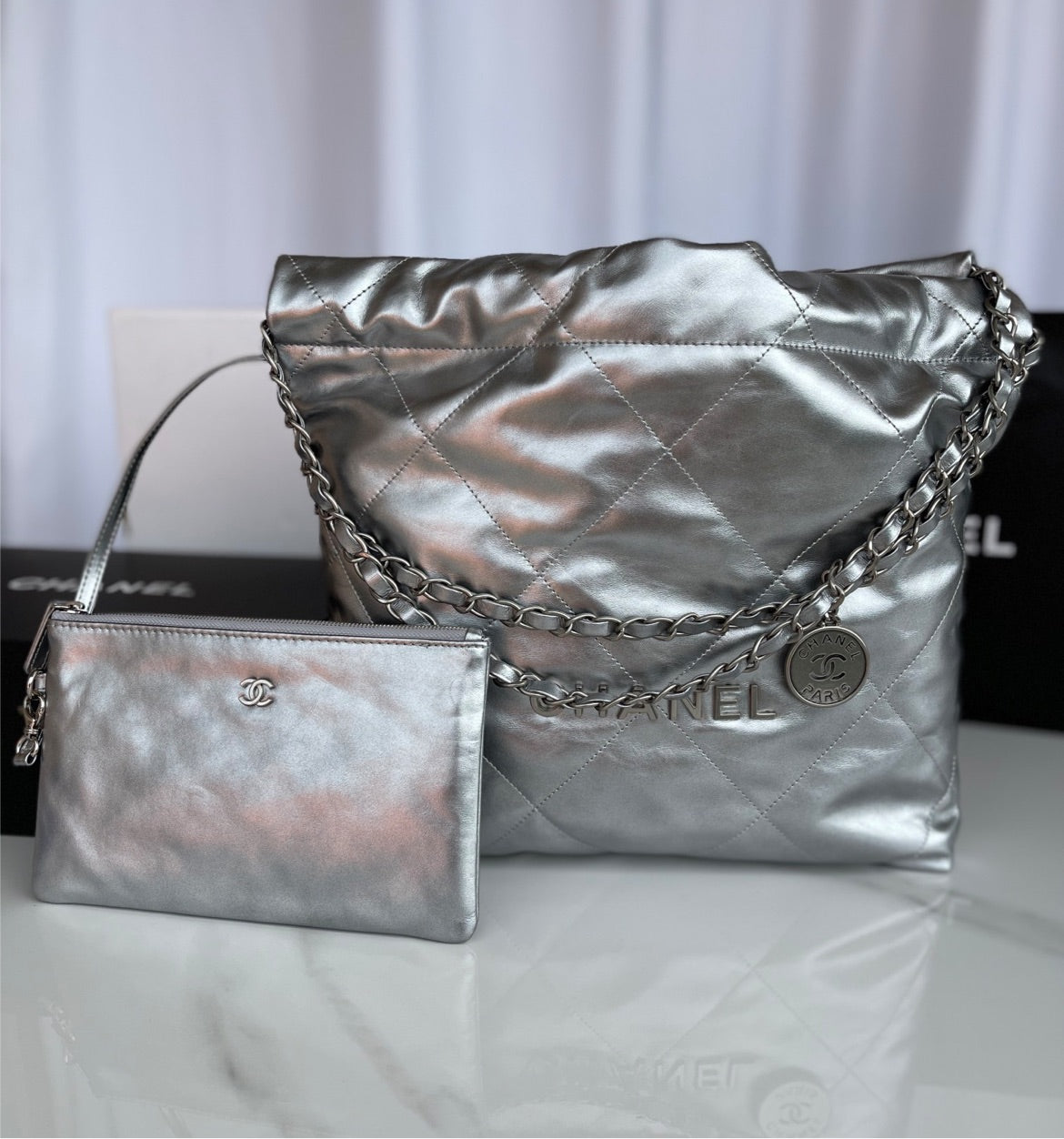 Silver Chanel woman shoulder handbag