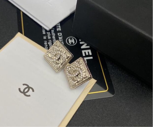Silver Chanel studs