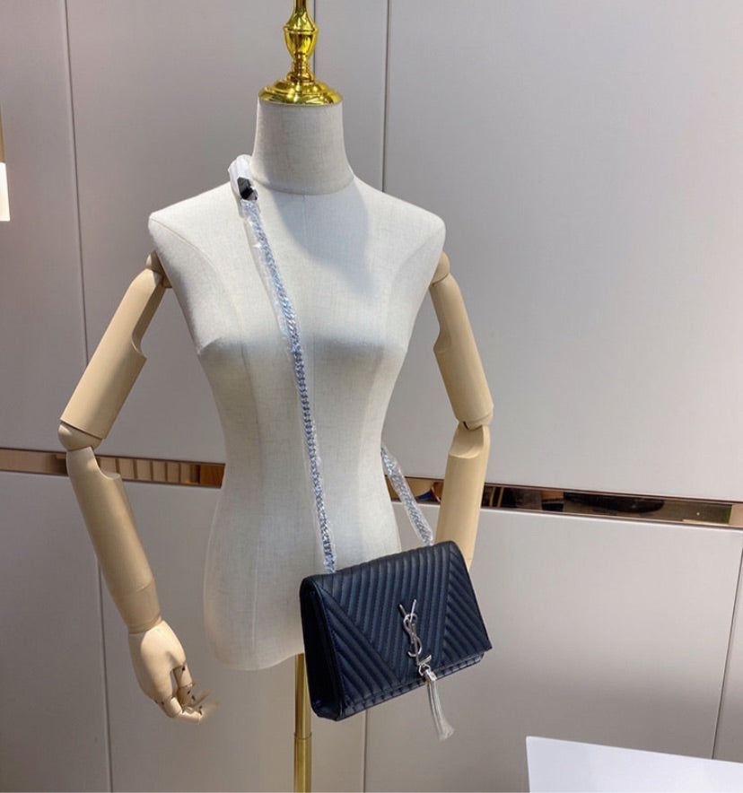 Black woman YSL shoulder handbag