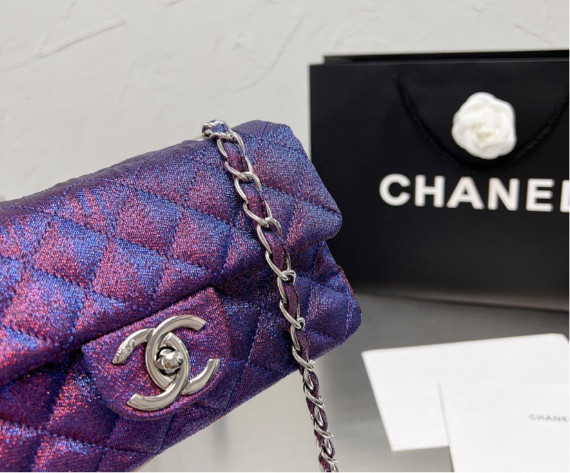 New woman Chanel purple handbag