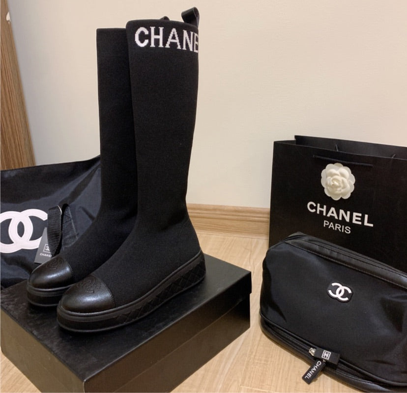 Black Chanel woman boots