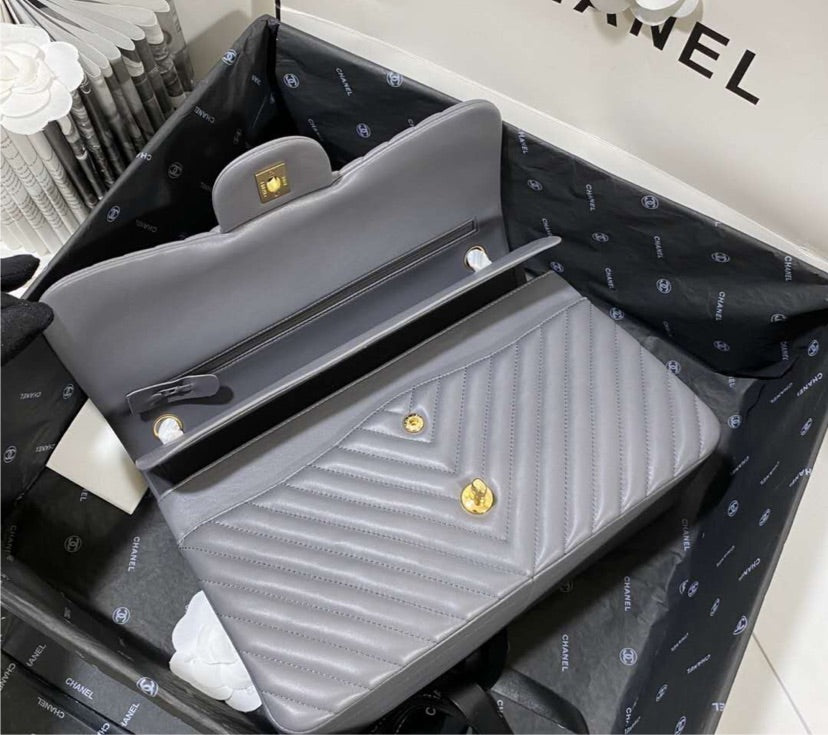 Grey Chanel woman handbag