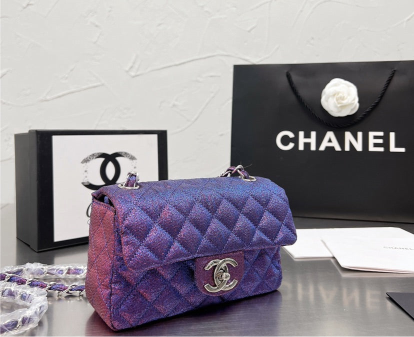 New woman Chanel purple handbag