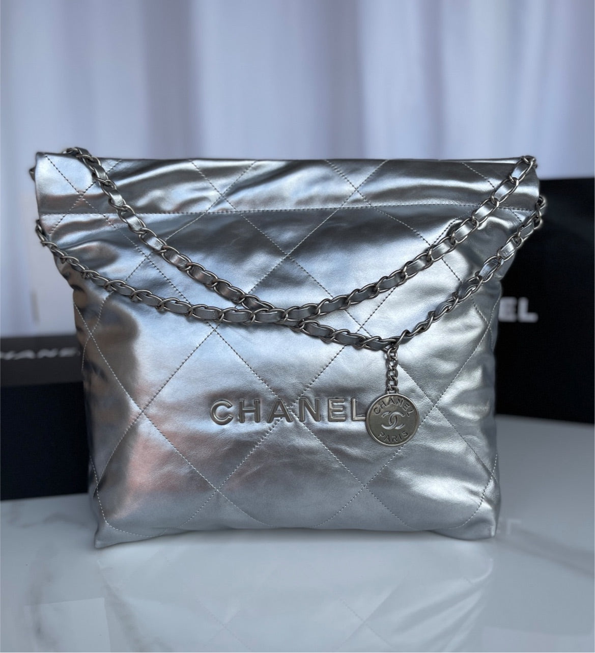 Silver Chanel woman shoulder handbag