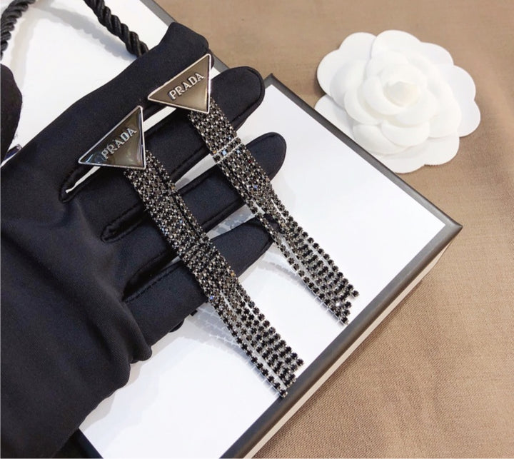 Prada woman earrings