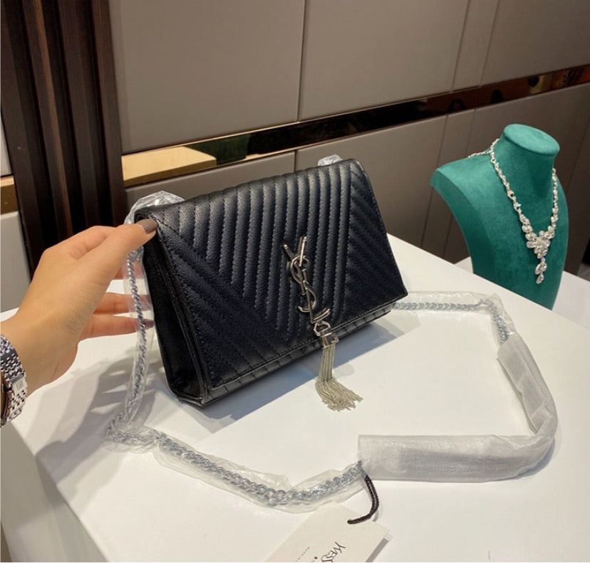 Black woman YSL shoulder handbag