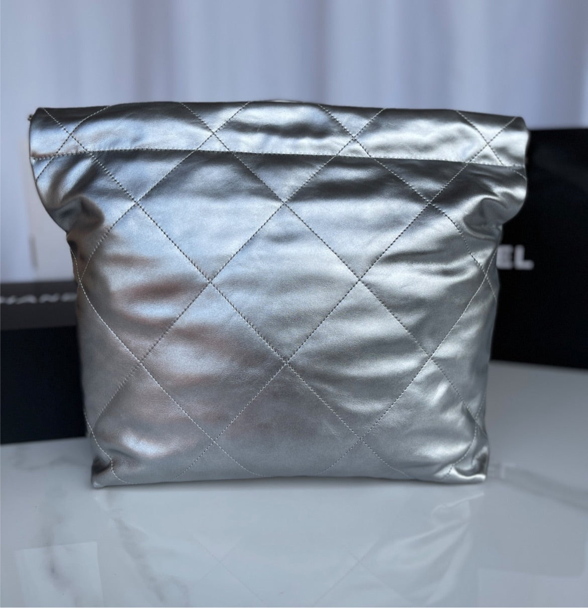 Silver Chanel woman shoulder handbag