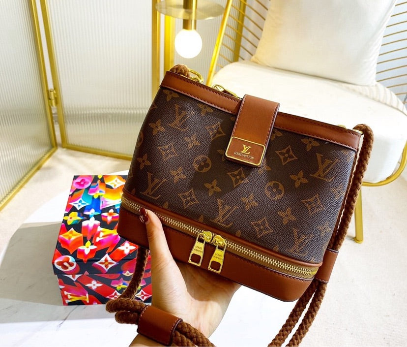 LV woman brown shoulder handbag