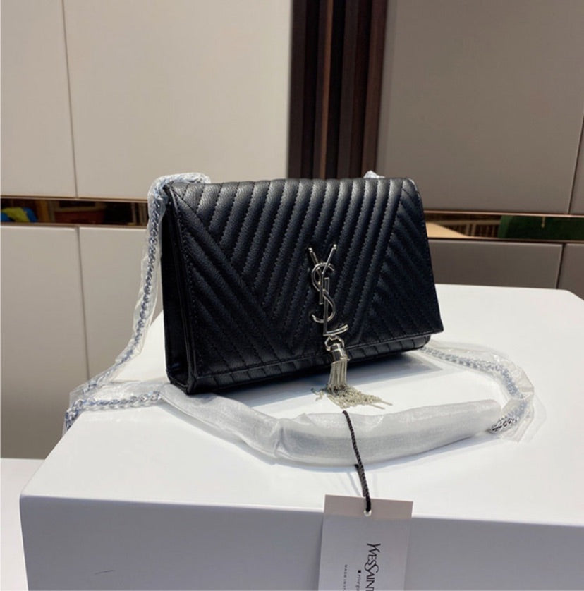 Black woman YSL shoulder handbag