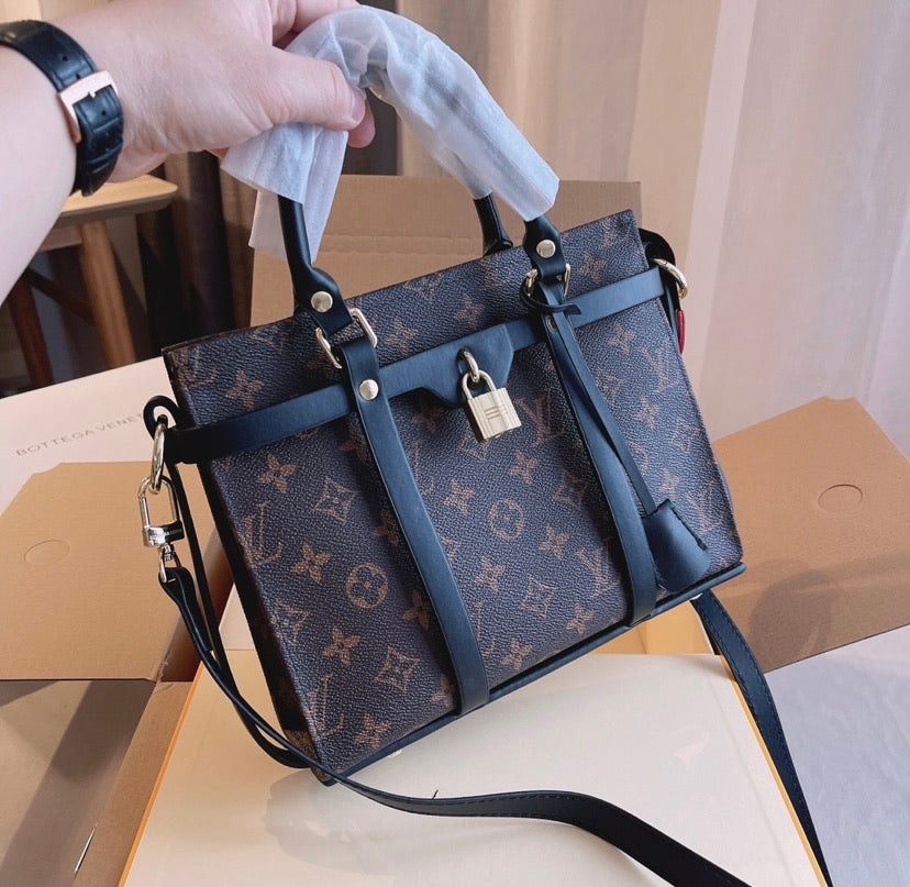 LV a woman shoulder handbag