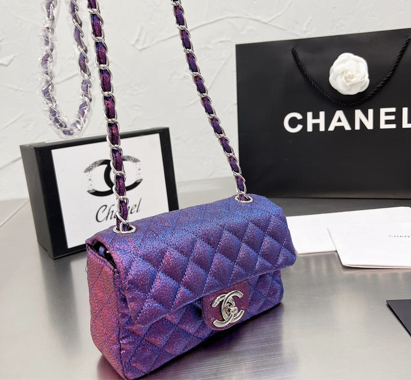 New woman Chanel purple handbag
