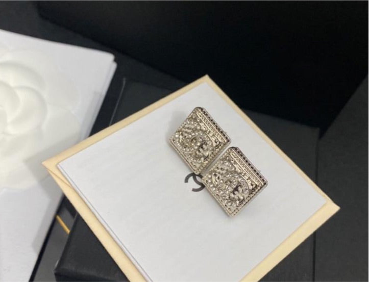 Silver Chanel studs