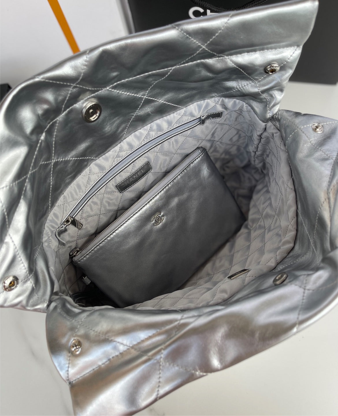 Silver Chanel woman shoulder handbag